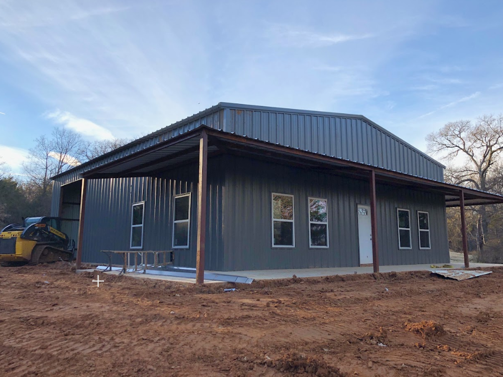 Barndominium exterior with covered porch